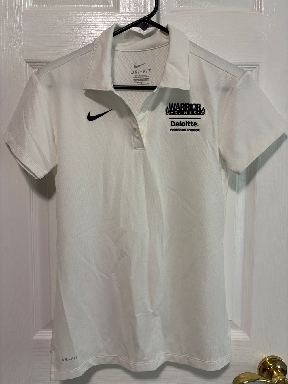 Nike White Polo with Black Nike Swoosh gold shirt